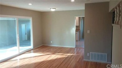 Dining area in living room adjacent to kitchen