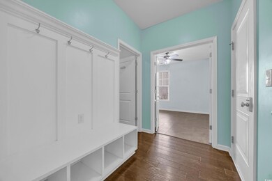 Mudroom featuring baseboards, a ceiling fan, and d
