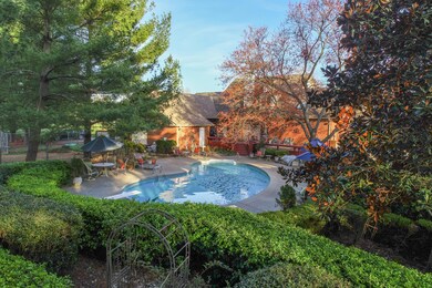 Pool area behind house