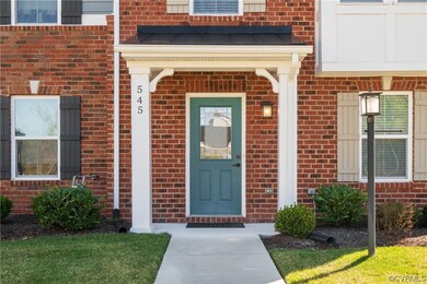 Doorway to property with a yard