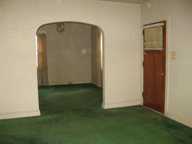 View from living room of front entrance and dining