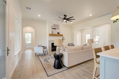 Living room with high ceilings and a statement fireplace.