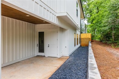 Property entrance featuring board and batten siding