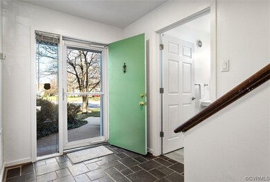 Foyer with dark slate tile flooring