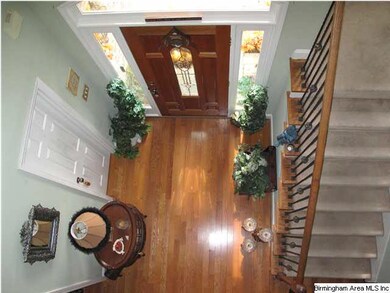 Upstairs catwalk overlooks the foyer and staircase