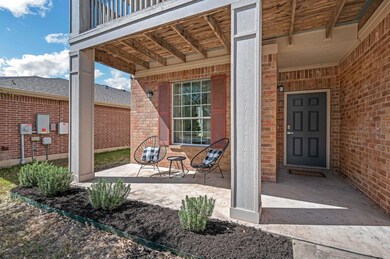 Property entrance featuring brick siding and a ba