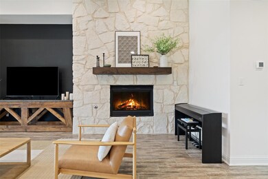 Living room with baseboards, wood finished floors