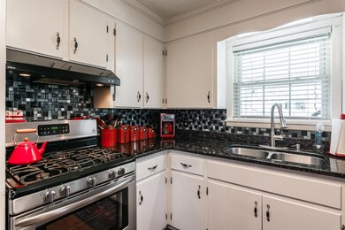 Kitchen has new tile back splash and new gas stove.   Makes cooking a joy!