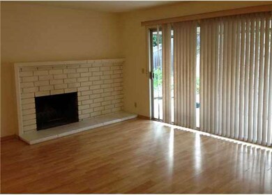 Spacious living room with wood burning fireplace, 