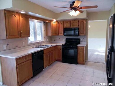 Kitchen ceramic tile floor, refrigerator and range