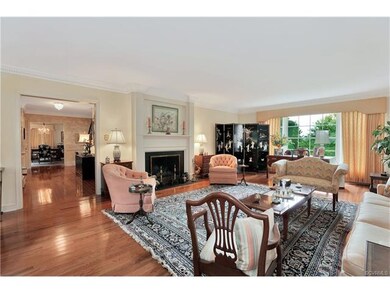 Formal living room features a wood burning firepla
