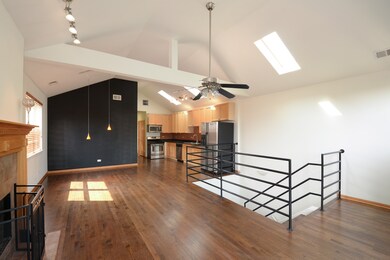 Vaulted ceilings, beams and skylights create a dra