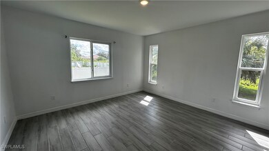 Spare room featuring hardwood / wood-style floors
