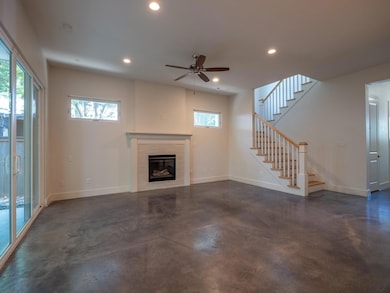 Unfurnished living room with concrete floors, rec