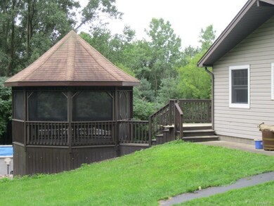 Screened gazebo connects to the deck.