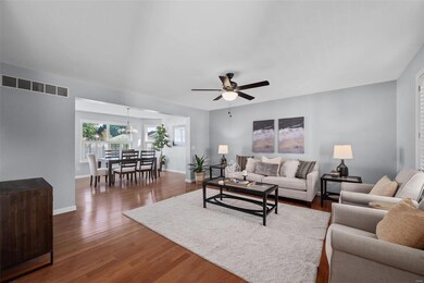 Living room opens to dining room & kitchen.