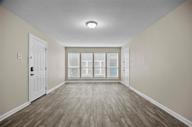 Spare room with vinyl plank flooring