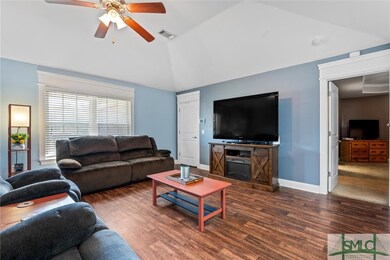 Vaulted ceiling with refreshing lighted fan.