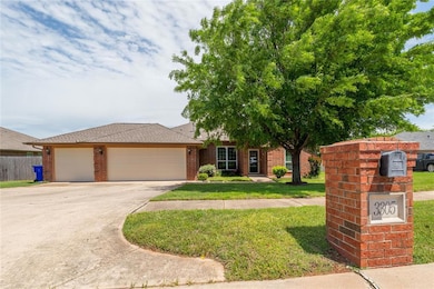View of front of home with a garage, concrete driv