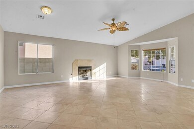 Living room w/ fireplace & ceiling fan/light