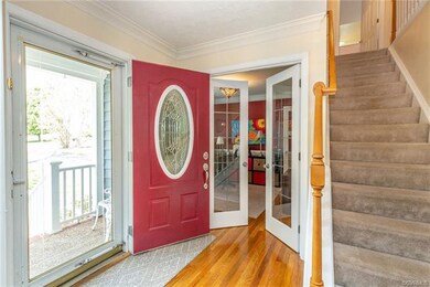 Bright and airy Foyer with hard woods through out 
