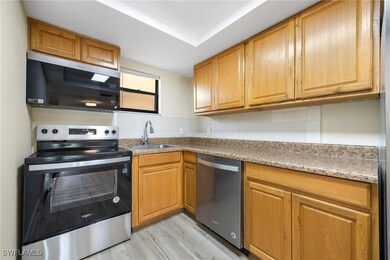 Kitchen with a sink, light wood-type flooring, bac