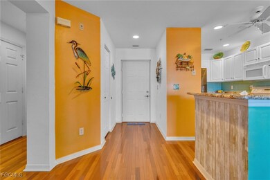 Corridor with light wood-style floors and recessed lighting