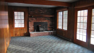 Living Room with Brick Fireplace