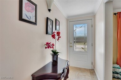 Doorway featuring ornamental molding