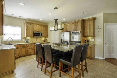 The kitchen also boasts stainless steel appliances, double ovens, and a walk in pantry. Refrigerator is included.