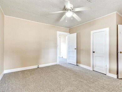 Unfurnished bedroom featuring carpet floors, ornam