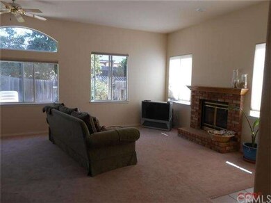 View of living room with fireplace.