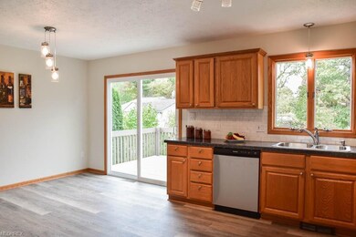 The kitchen opens to the dining room.