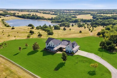 Sits atop 83 Acres with Lake & Pond Views
