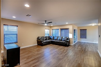 Living room featuring beautiful LVP flooring, a ce