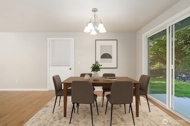 The spacious dining area - sliding glass doors open to the backyard.  Virtually Staged