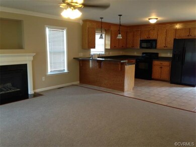 GREAT ROOM WITH FIREPLACE OPEN TO KITCHEN WITH BRE