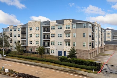 Modern four-story condominium. It features balconi