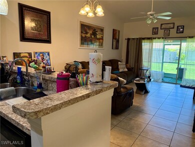Living room with light tile patterned flooring, ce