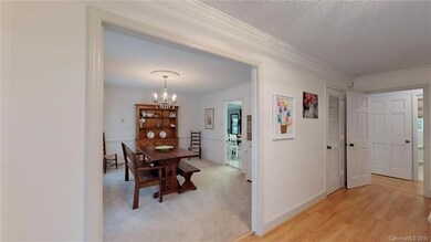 Formal dining room is to the left of entrance.