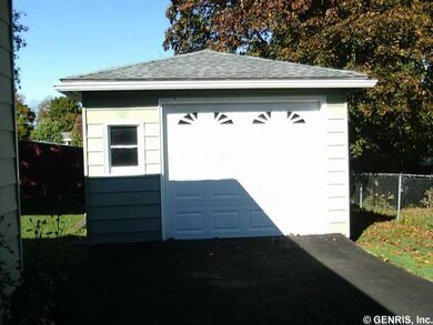 Other. Garage with black top driveway.