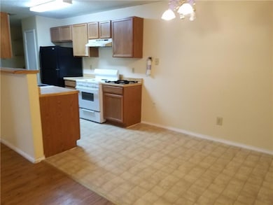 Kitchen with freestanding refrigerator, white gas