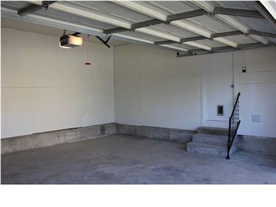freshly painted garage with new opener, and entry 