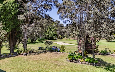 Islands of plantings screen house from course but don't obstruct your view of play.