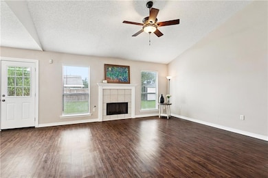 Family room with fireplace and door leading to bac