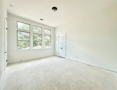 Empty room featuring unfinished concrete floors a