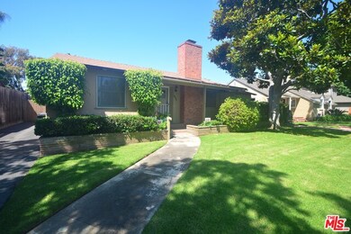 Long driveway, sidewalk and wide street