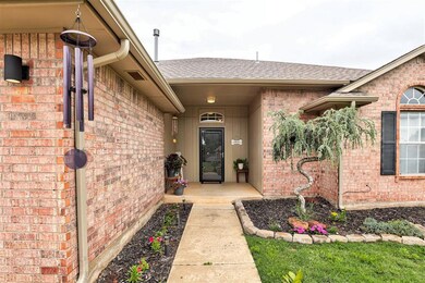Property entrance with brick siding and a shingled roof