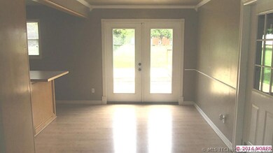 large dining area with laminate wood floors