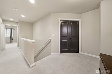 Spacious hallway leading to spare bedrooms.